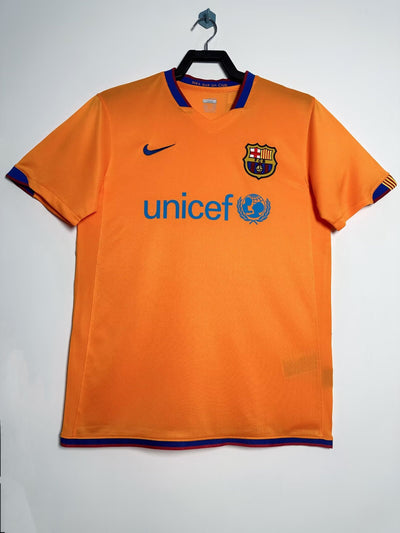 Camiseta FC Barcelona 2006-2007 Away, Nike, UNICEF sponsor, orange with blue accents.