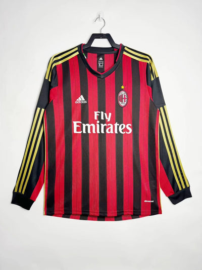 AC Milan 2013-2014 home jersey by Adidas, red and black stripes, yellow accents, long sleeves.