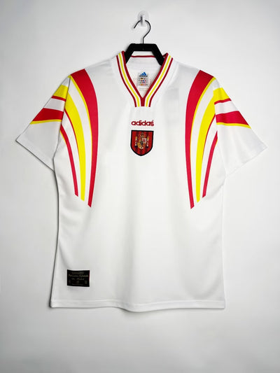 Camiseta España 1994 Away de Adidas con diseño blanco y detalles rojos y amarillos.