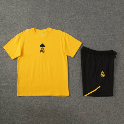 Yellow short sleeve T-shirt with black short trousers.